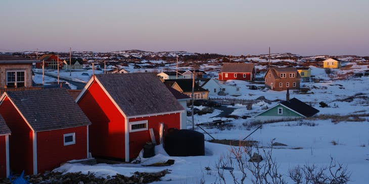 Houses surrounded by snow on a cold day in Nova Scotia.