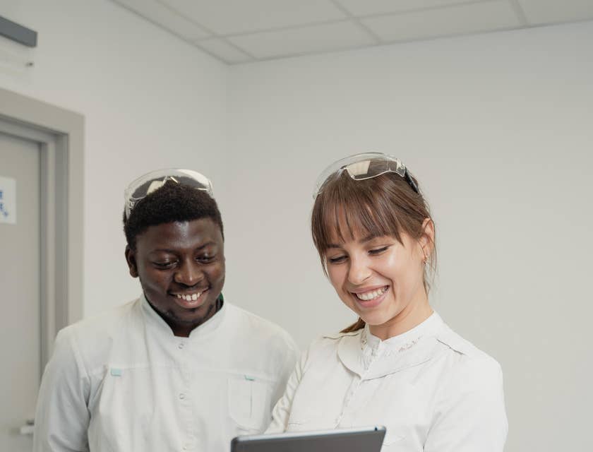 Nurse educator shows clinical record to a nursing student.
