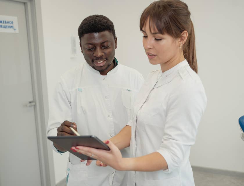 The nurse manager orients the new staff member.