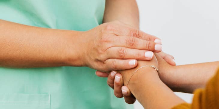 Nurse navigator providing emotional support to a patient.