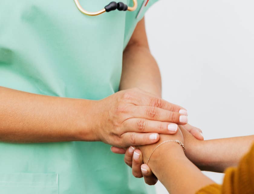 Nurse navigator providing emotional support to a patient.