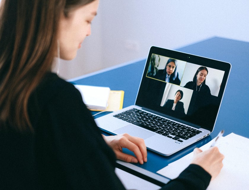 Online marketing executive having a video conference with clients to discuss trends