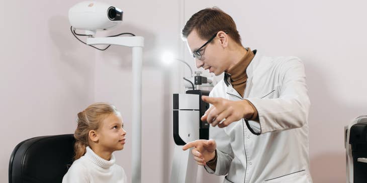 Optometric technician explaining the testing process to a patient.