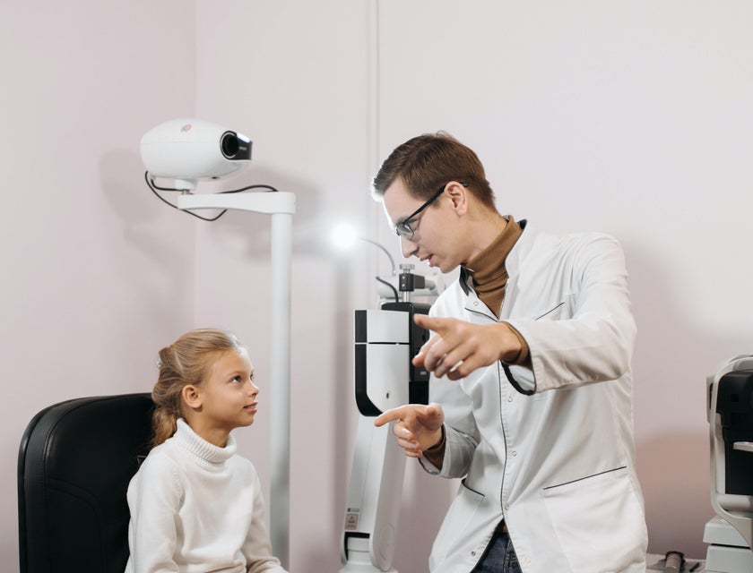 Optometric technician explaining the testing process to a patient.