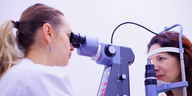 An optometrist performing eye inspections.
