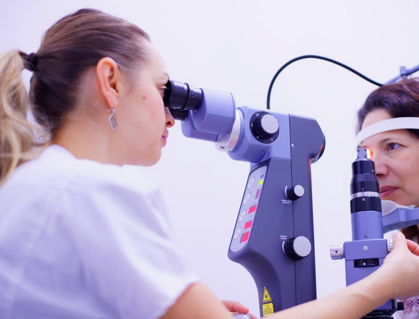 An optometrist performing eye inspections.