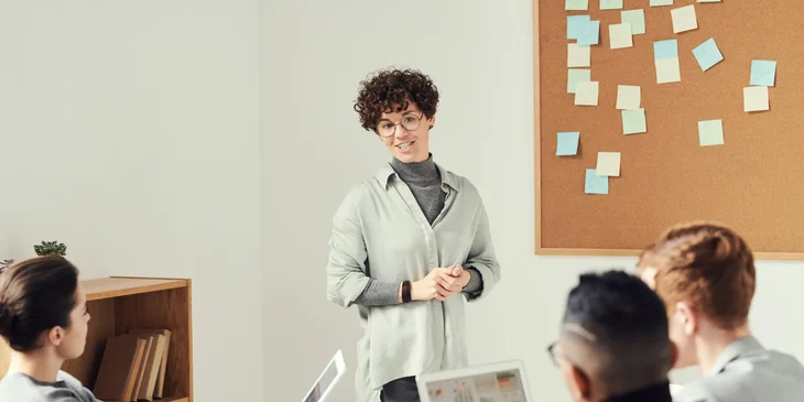 An organizational consultant having a meeting with her team.