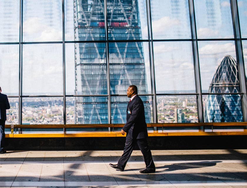 Man walking past glass window