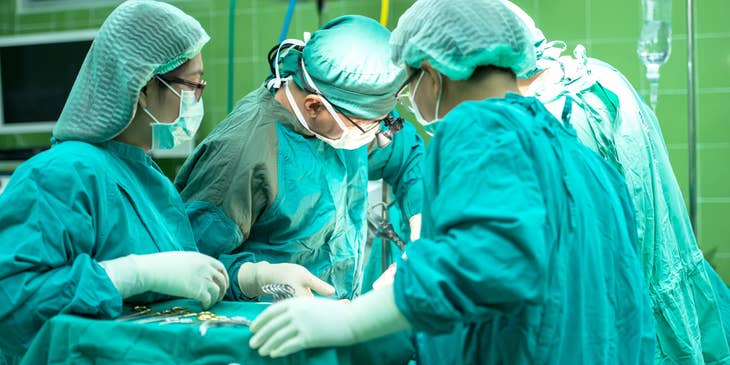 Orthopedic surgeon performing a surgical procedure.