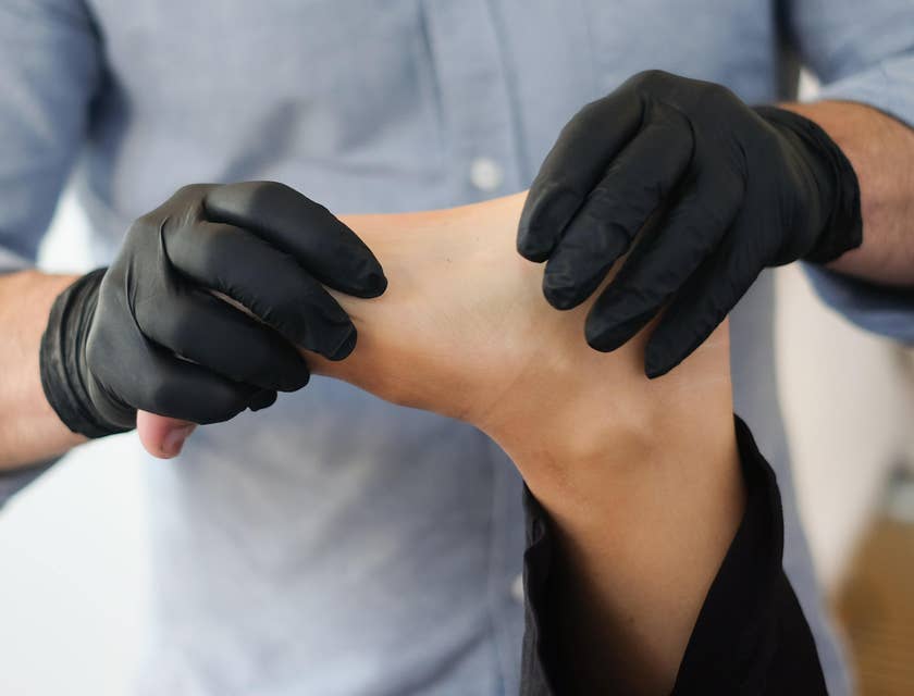 Osteopathic doctor is performing a variety of movements to help diagnose illnesses.