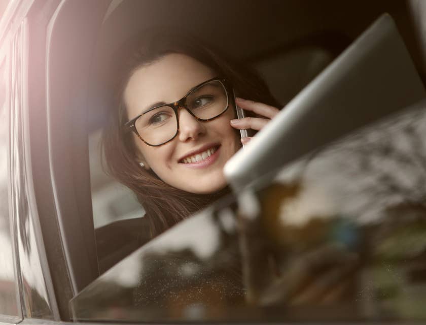 Outside sales representative on the way to meet a new client she's talking on the phone.