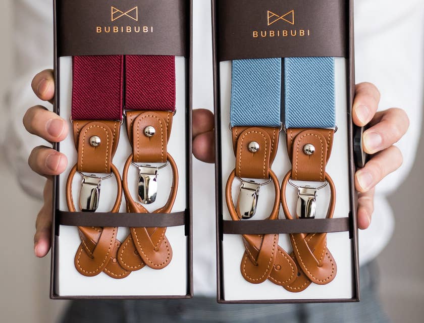 Packaging designer showing off the new packaging design for the new line of suspenders.