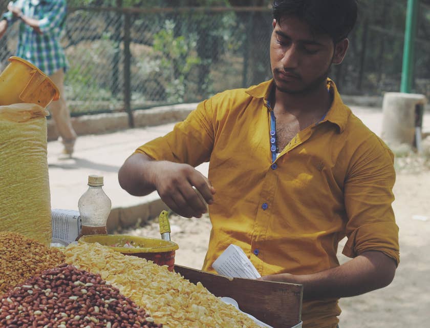 A man doing part-time work at a market.