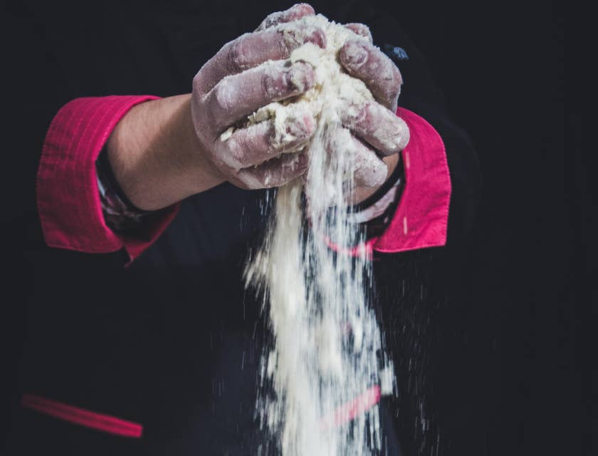 Pastry cook preparing ingredients for baking.
