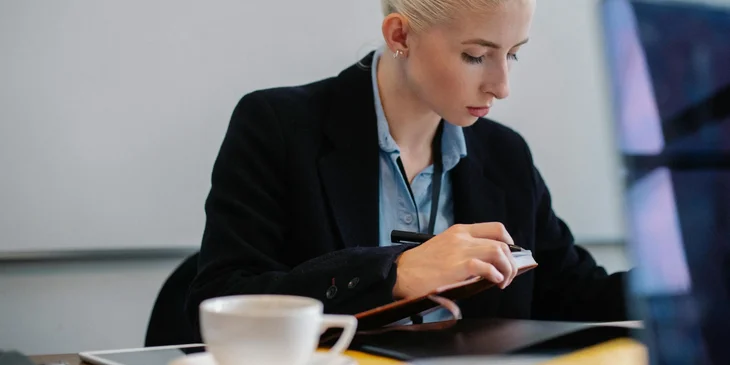 A payroll manager checking documents.