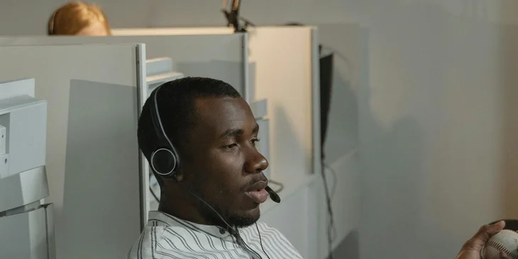 A PBX operator talking on a headset.