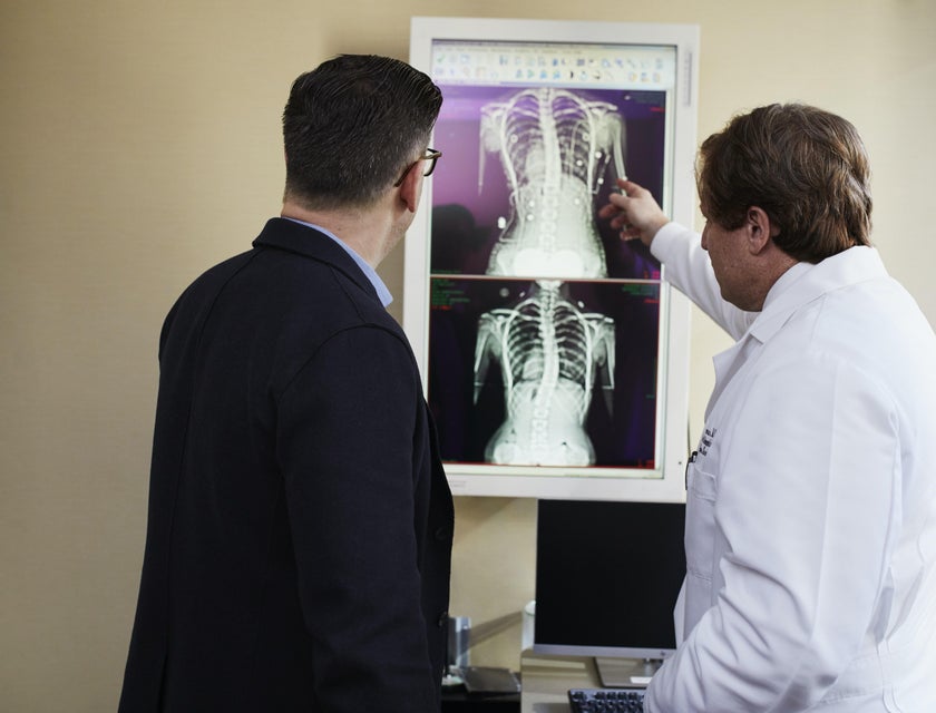 Pediatric geneticist explaining lung condition to the patient's patient while showing Xray results.
