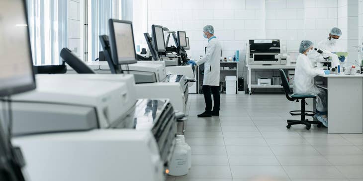 Embryologists working in a laboratory setting.