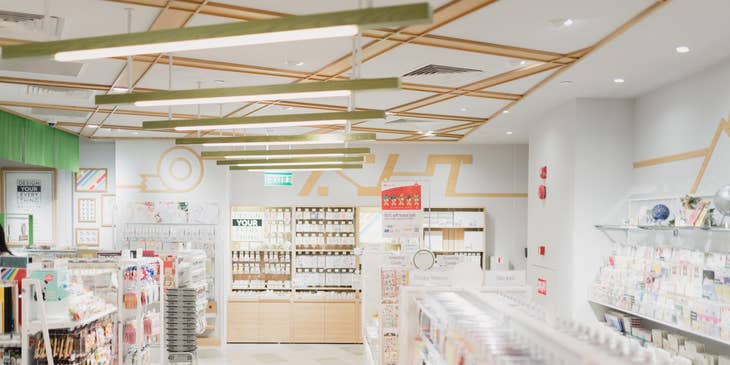 A pharmacy with shelves of medication and other products.