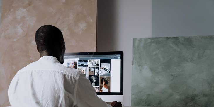 Photo editor browsing through his portfolio, looking for the next photo to edit.