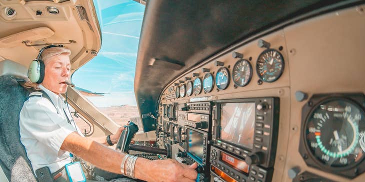 Pilot checking and setting the instruments and radios before taking off.