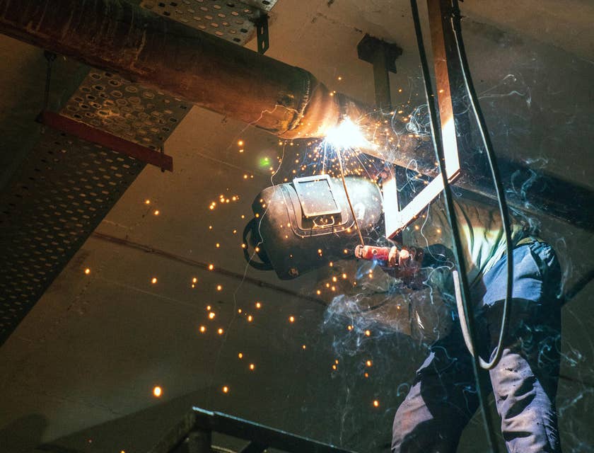 Pipe fitter installing a pipe system in  abuilding