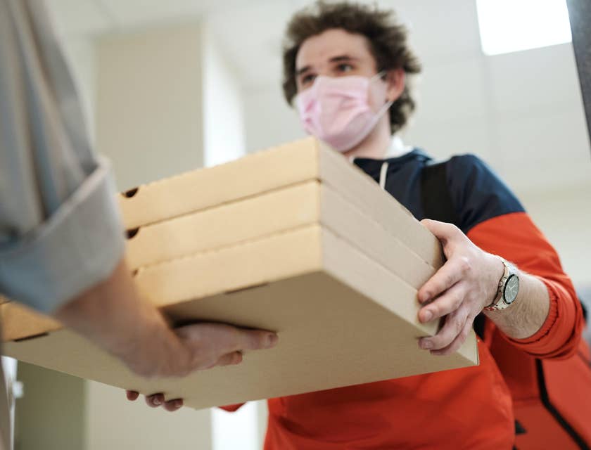 Pizza Delivery Driver delivering the customers order on the customers preferred location