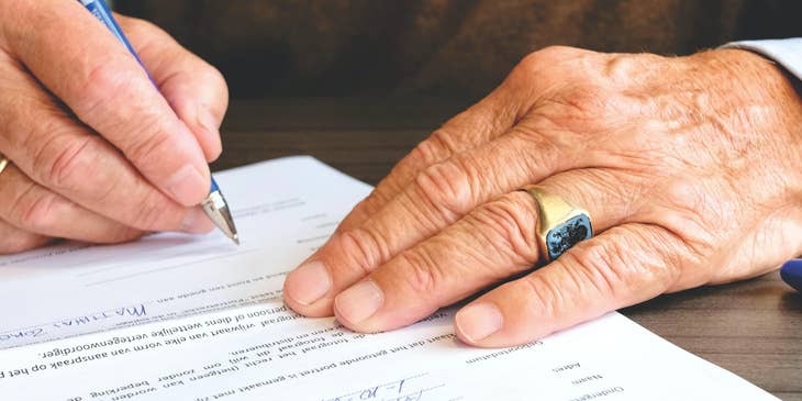 A lawyer signing a legal contract.