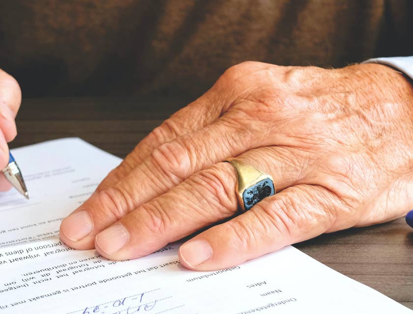 A lawyer signing a legal contract.