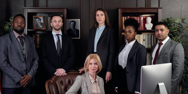 Photo of the president together with her executive team members while inside her office.