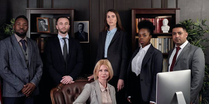 Photo of the president together with her executive team members while inside her office