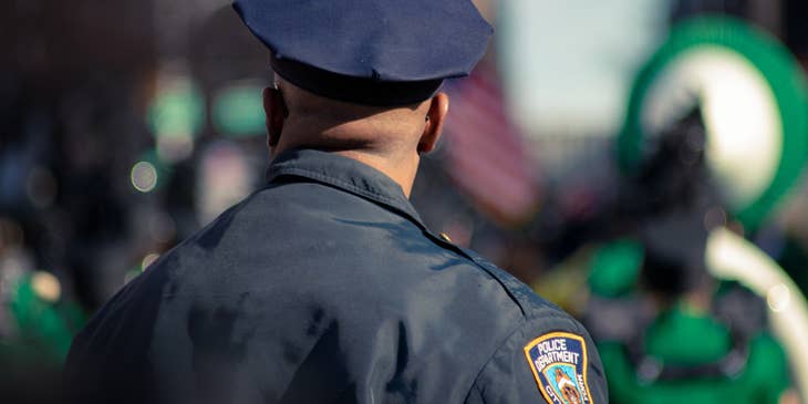 Prison warden wearing a police uniform while participating at an annual event.