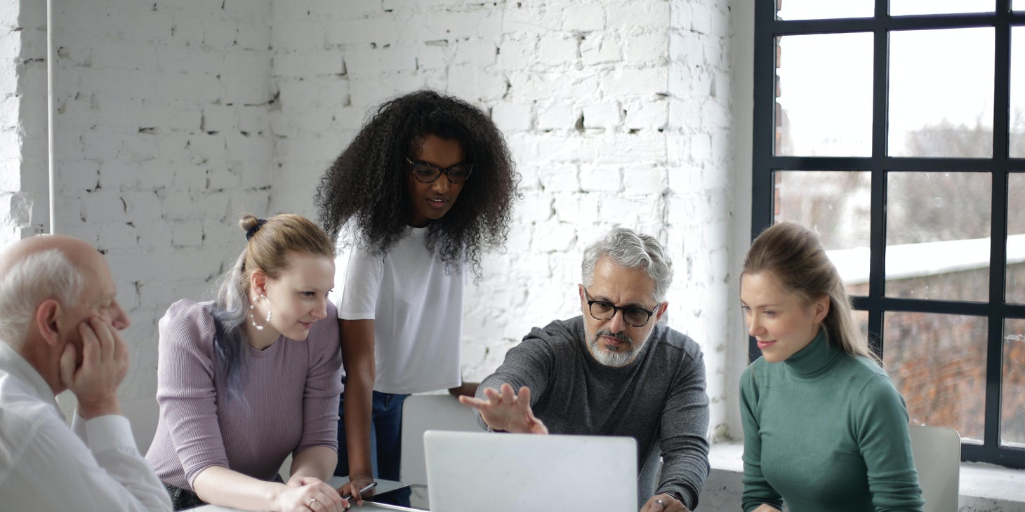 Procurement officer showing the goals and projection for the next season to the purchasing department