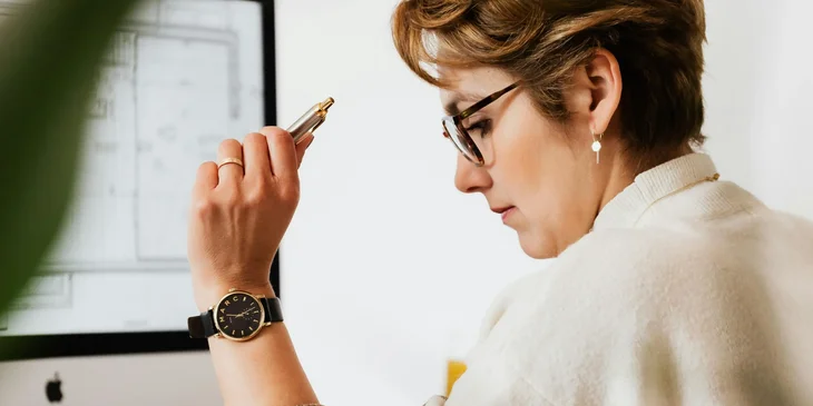 A product marketing manager working in front of a computer.