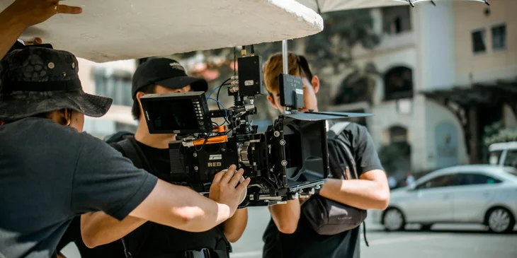 A production assistant helping the director.