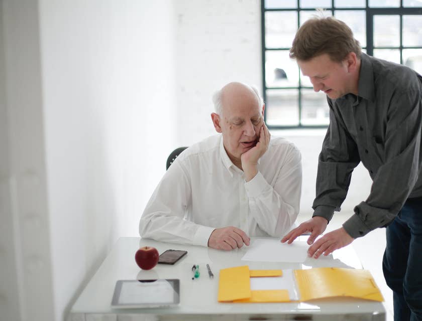 Production manager showing the client the budget and production expectations to the client.
