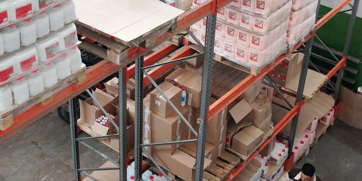 Production supervisor checking every item quality before forwarding it to shipping department.