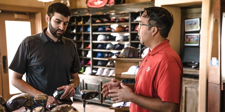Promoter introducing the new line of golf clubs to the customer