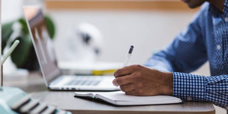 Qualitative researcher writing down research notes