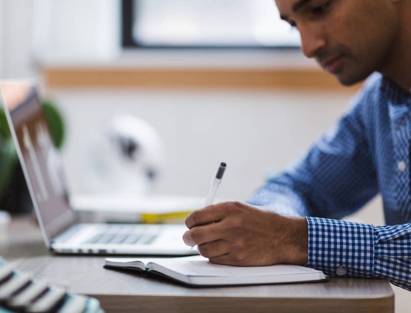 Qualitative researcher writing down research notes