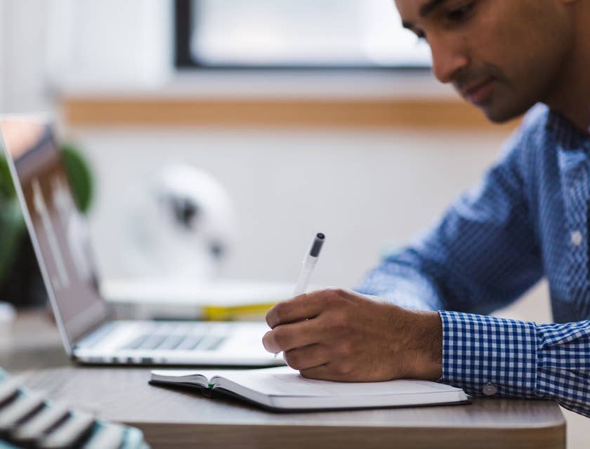 Qualitative Researcher writing down research notes