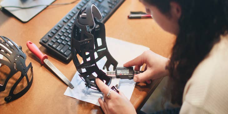female quality engineer checking the size of the new product