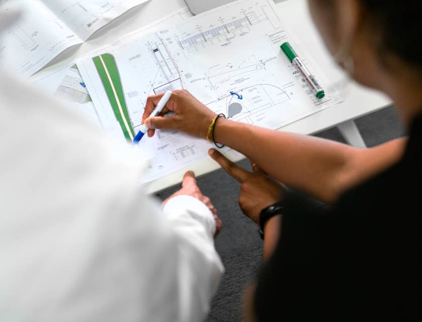 Quantity surveyor discussing the estimated cost for the construction project.