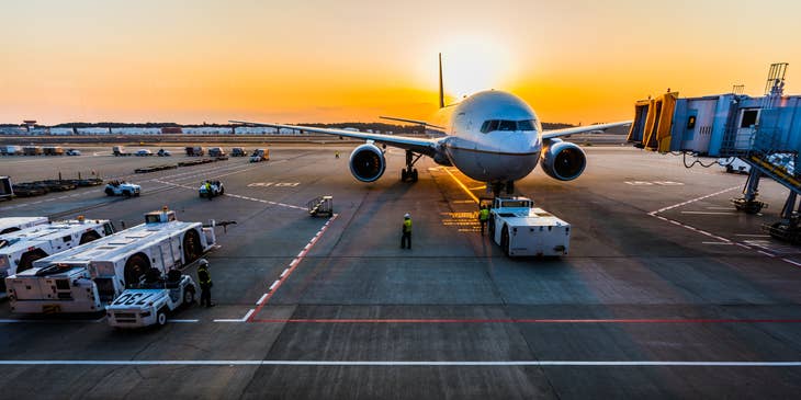Ramp agents preparing to unload the passengers baggage and cargo after the plane lands