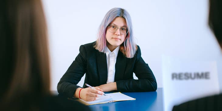 A female recruiting manager interviewing an applicant.