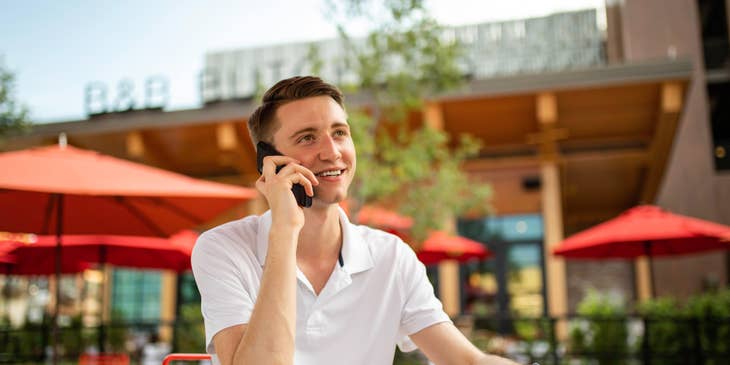 Retail sales consultant talking to a client over the phone discussing the company's product