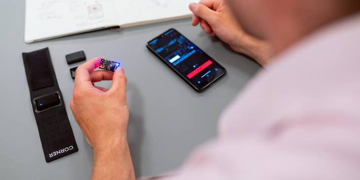 RF engineer holding a microchip to be inserted on a mobile phone