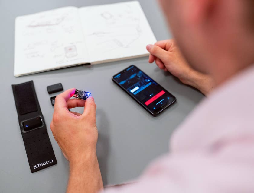 RF engineer holding a microchip to be inserted on a mobile phone