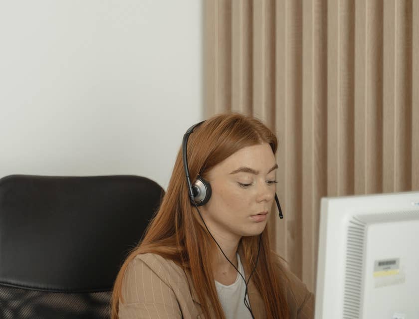 Sales administrator processing clients' order and payment online