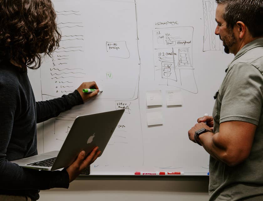 Sales and marketing associate brainstorming with the marketing lead in preparation for a new advertising campaign
